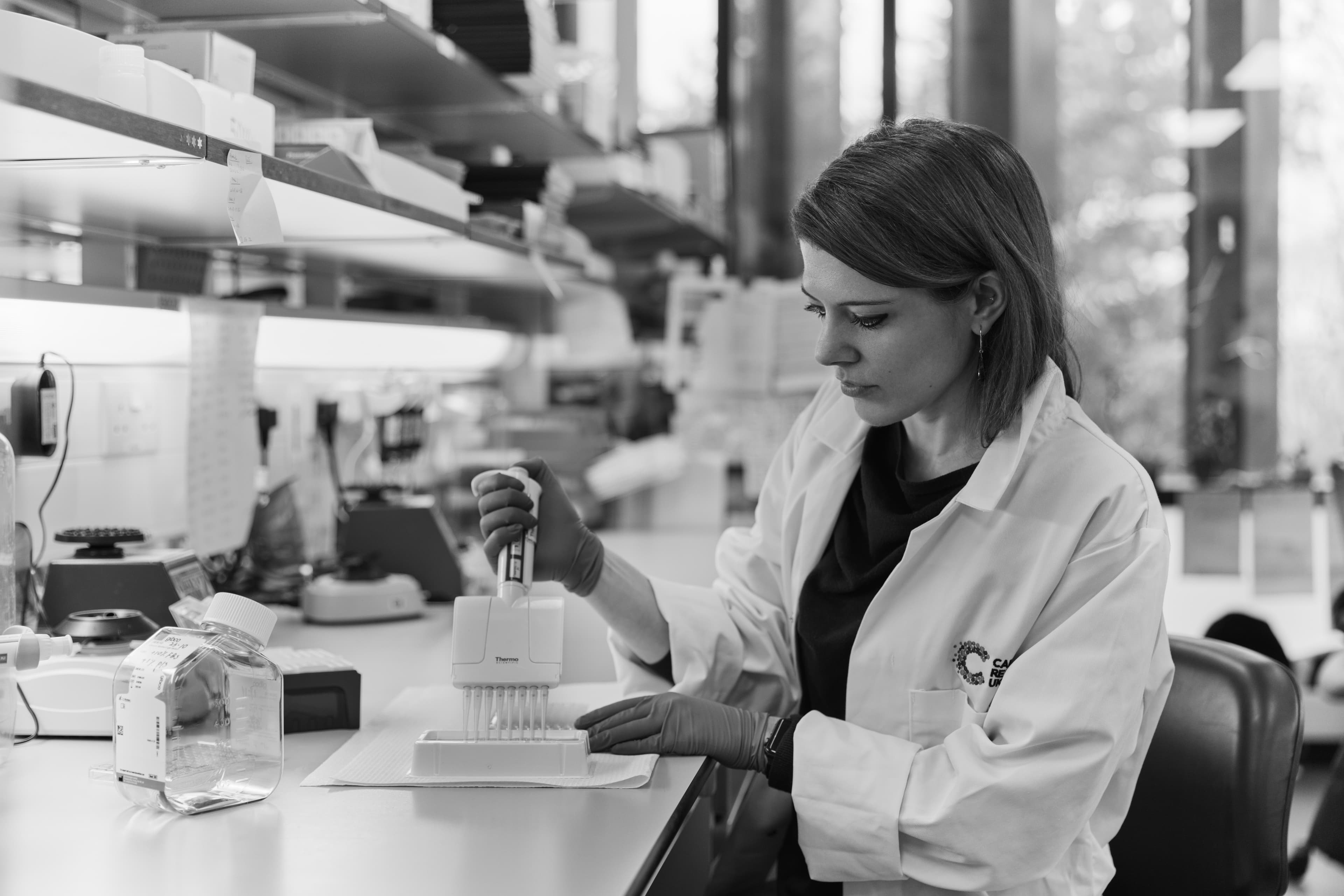 Image of scientist at her desk in her lab.