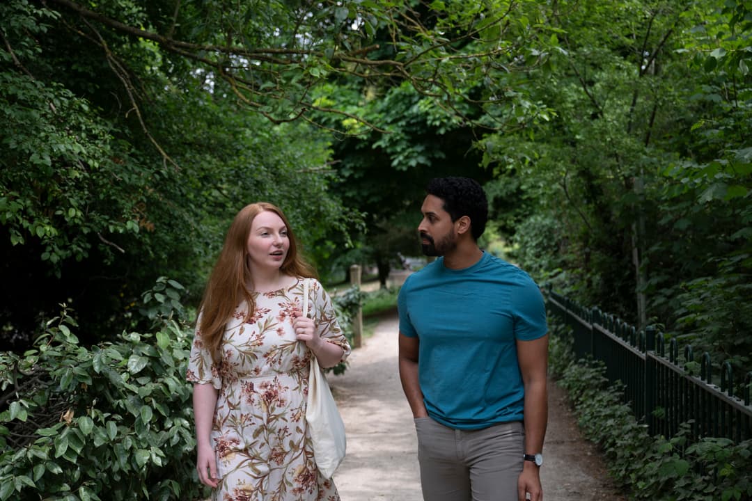 Man and woman walking in nature.
