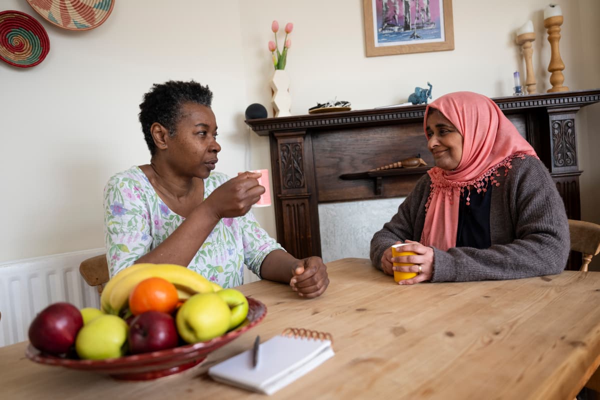 Two women talking.