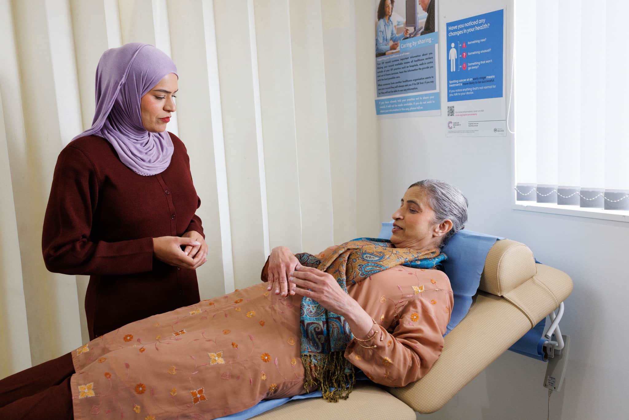 Patient discussing her symptoms with the doctor.