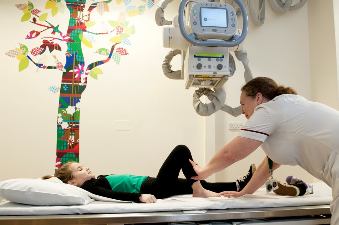 Photograph of a child having an x-ray.
