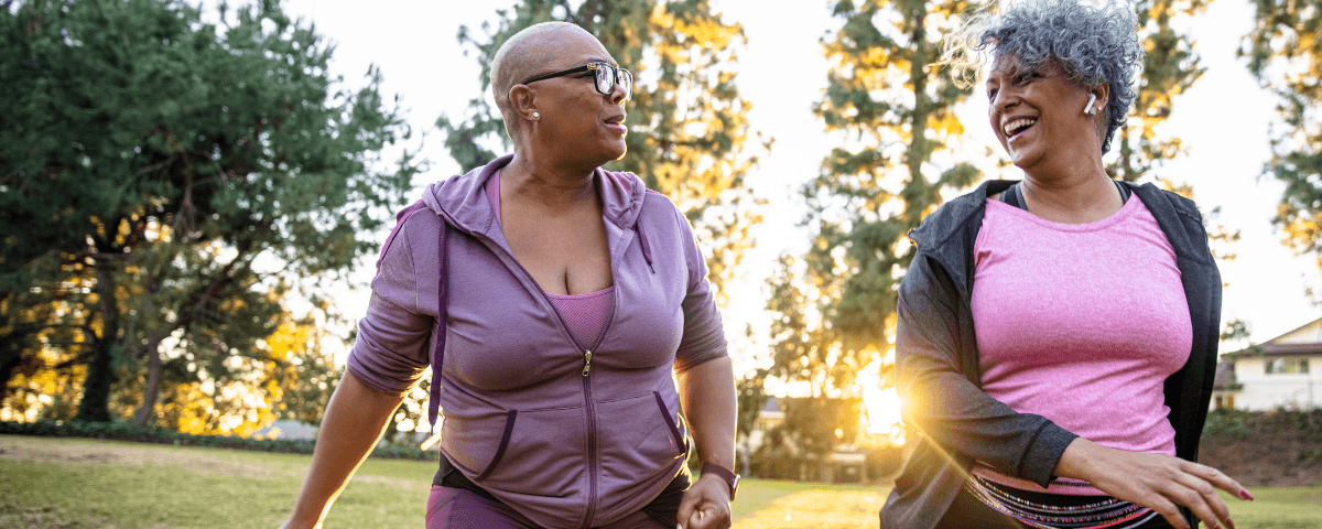 A picture of two women out on a walk in the park.