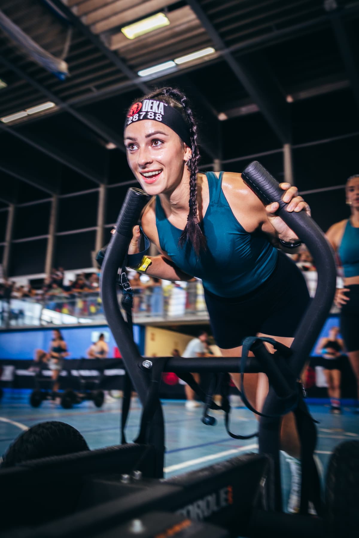 Woman is on a bike at a Deka event.