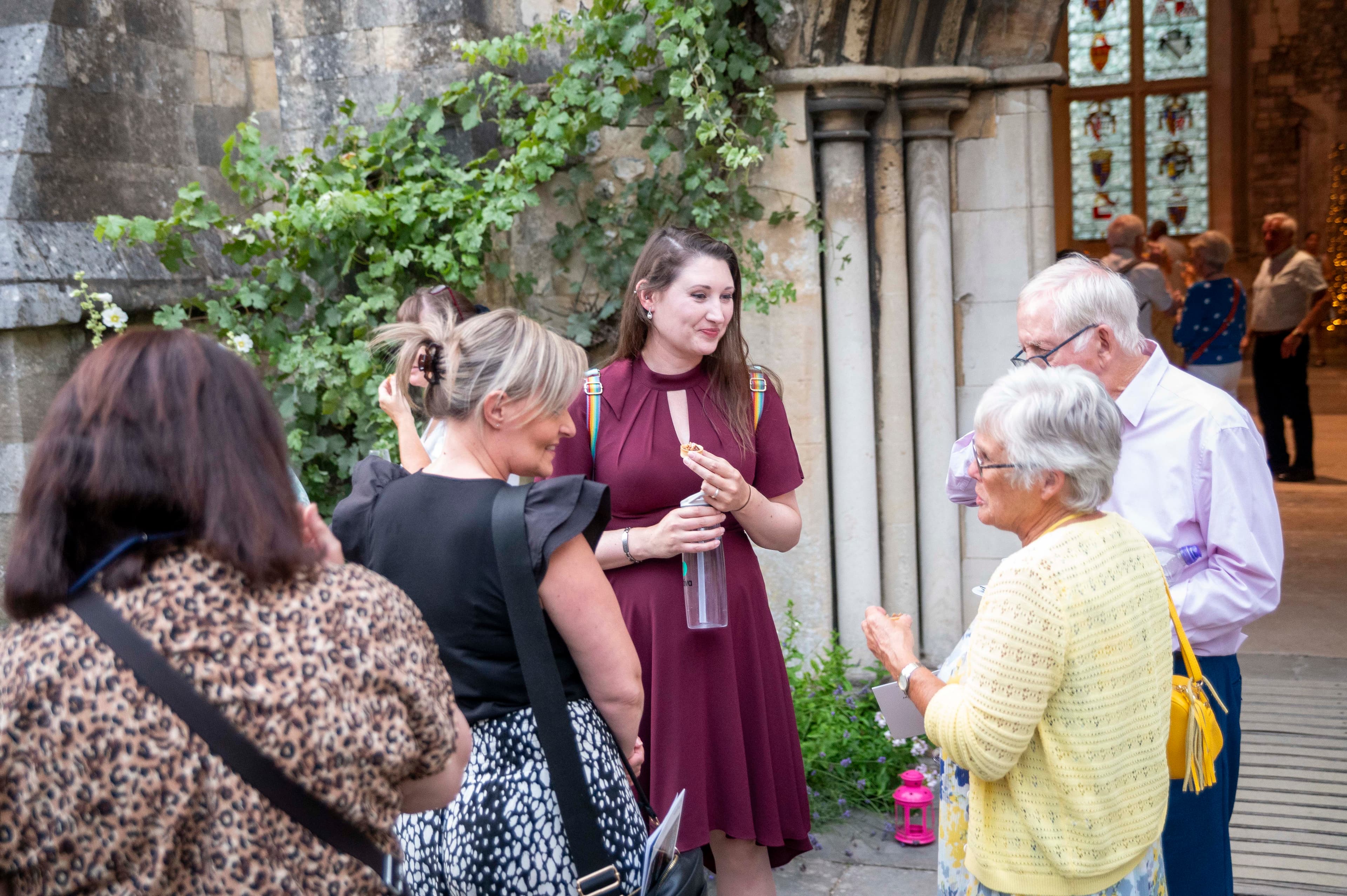 A group of people chatting at a Legacy event.