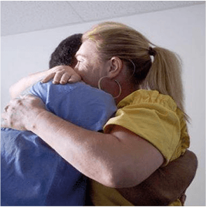 A photo of two people hugging.