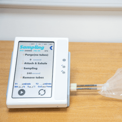 Image of the breath test. It looks like a plastic bag attached to a scanner.