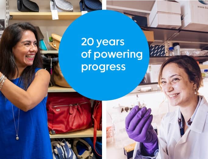 Shop volunteer and researcher smiling with 20 years text.
