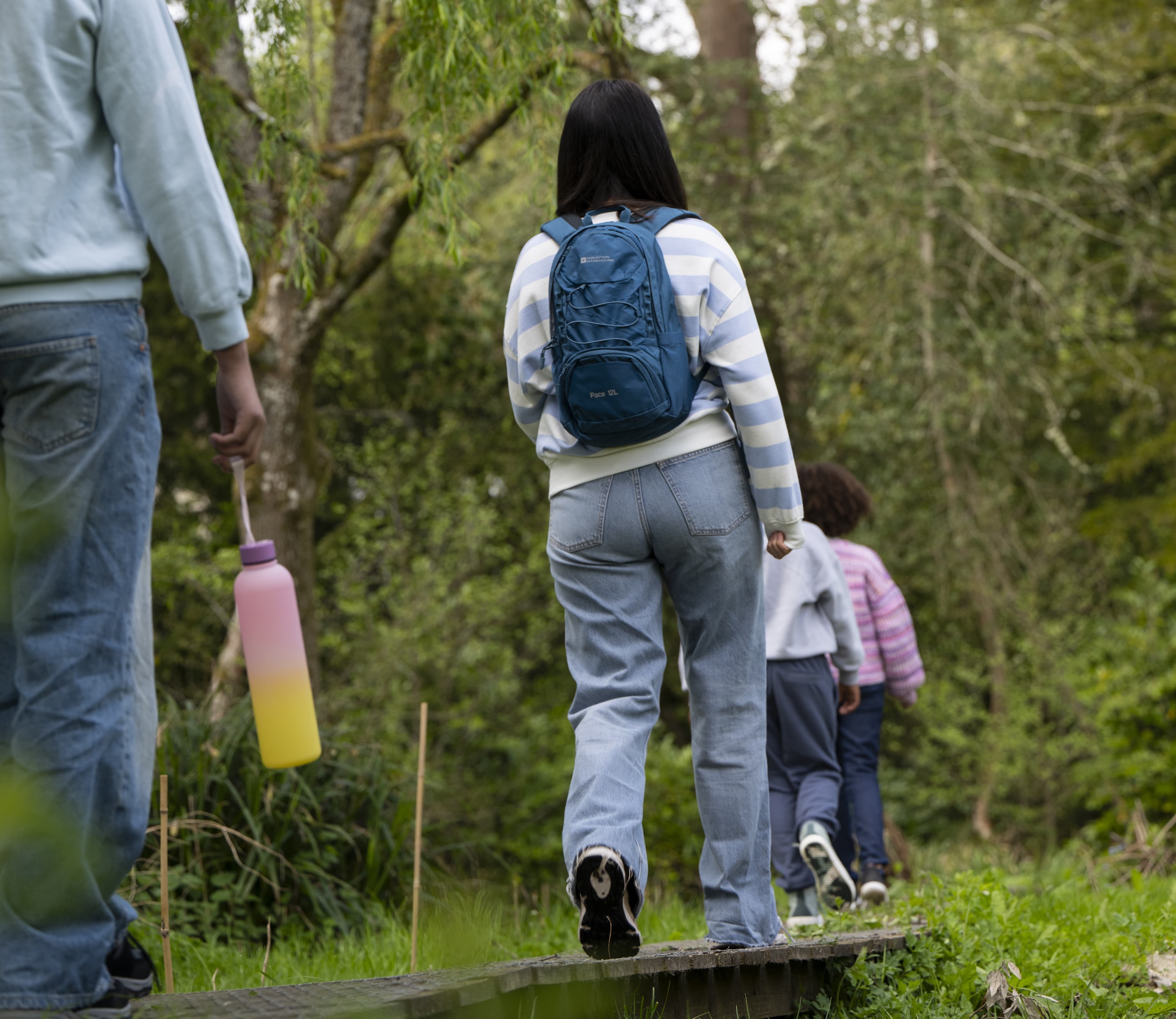 Picture of a group of people walking in the woodlands.