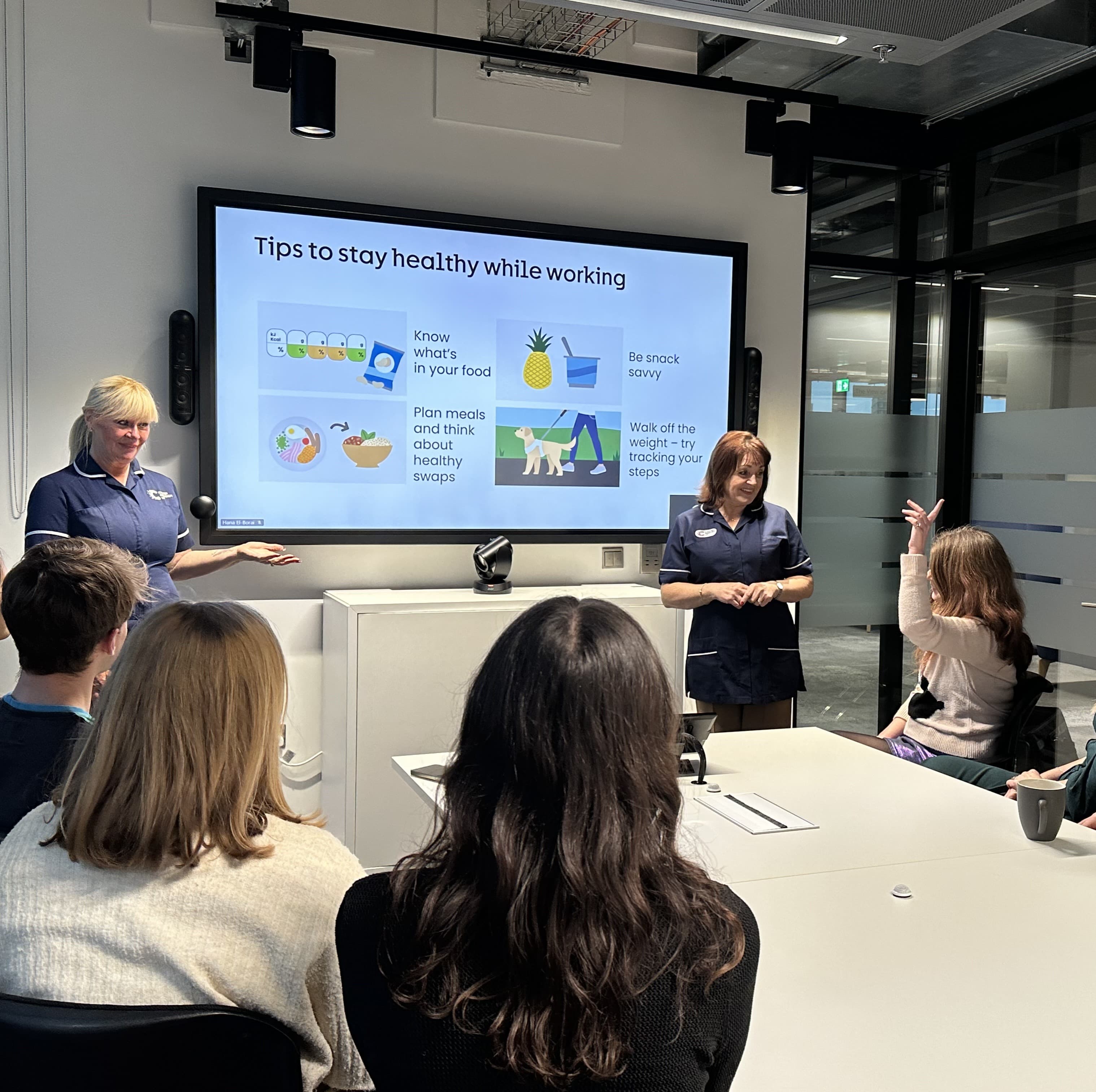 Cancer Awareness in the Workplace (CAW) being delivered in office meeting room.