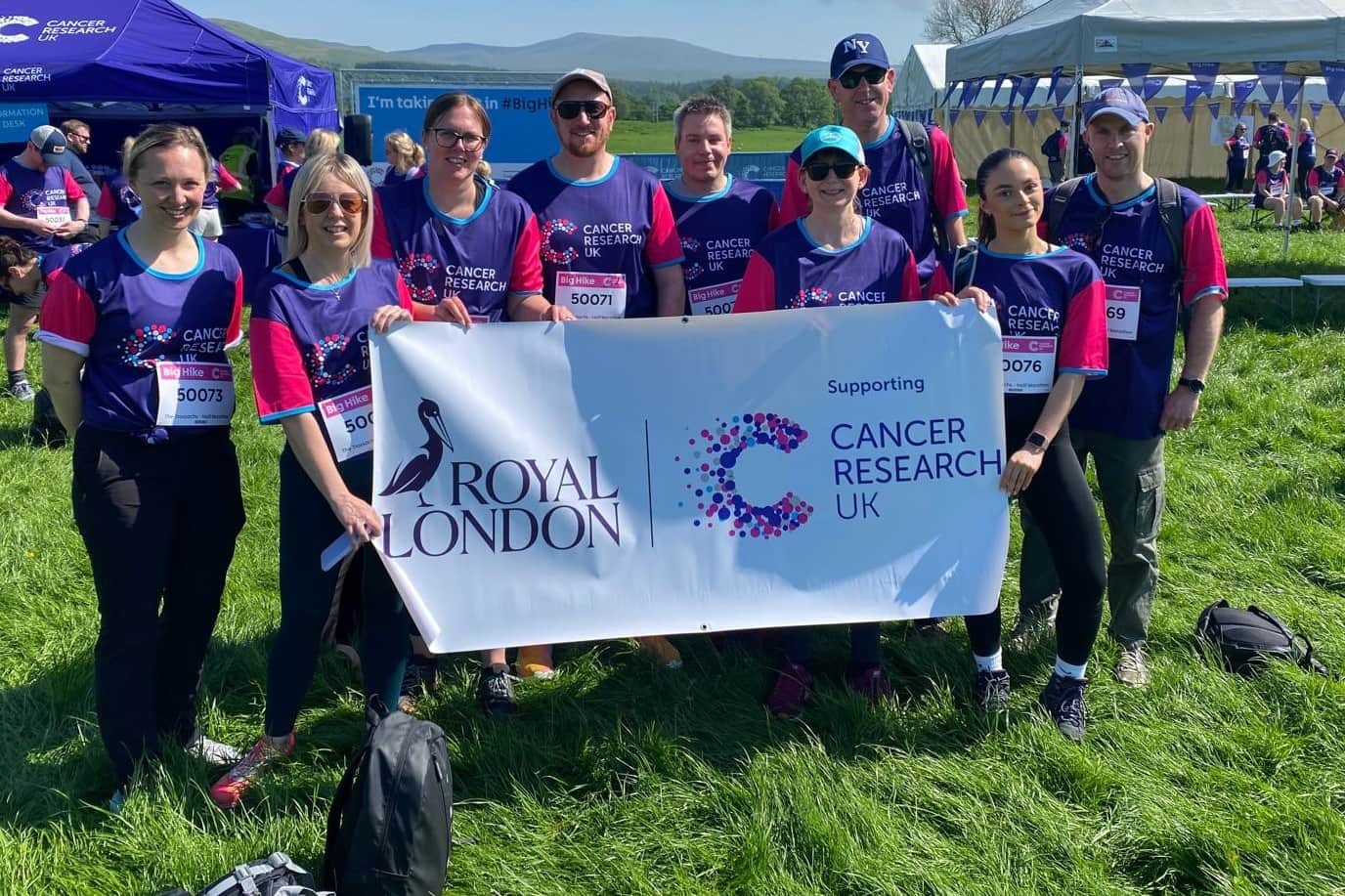 Royal London team at Big Hike. The weather is sunny and they look happy.