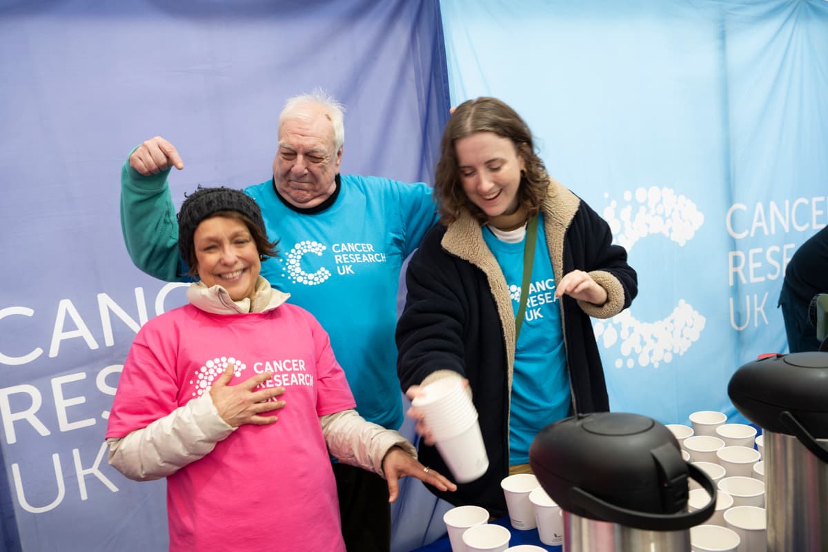 A photo of three Cancer Research UK volunteers.