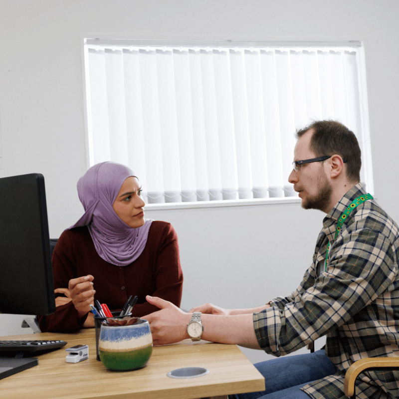 Health professional speaking to patient.