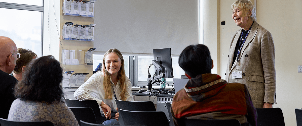 A group of people in a meeting.