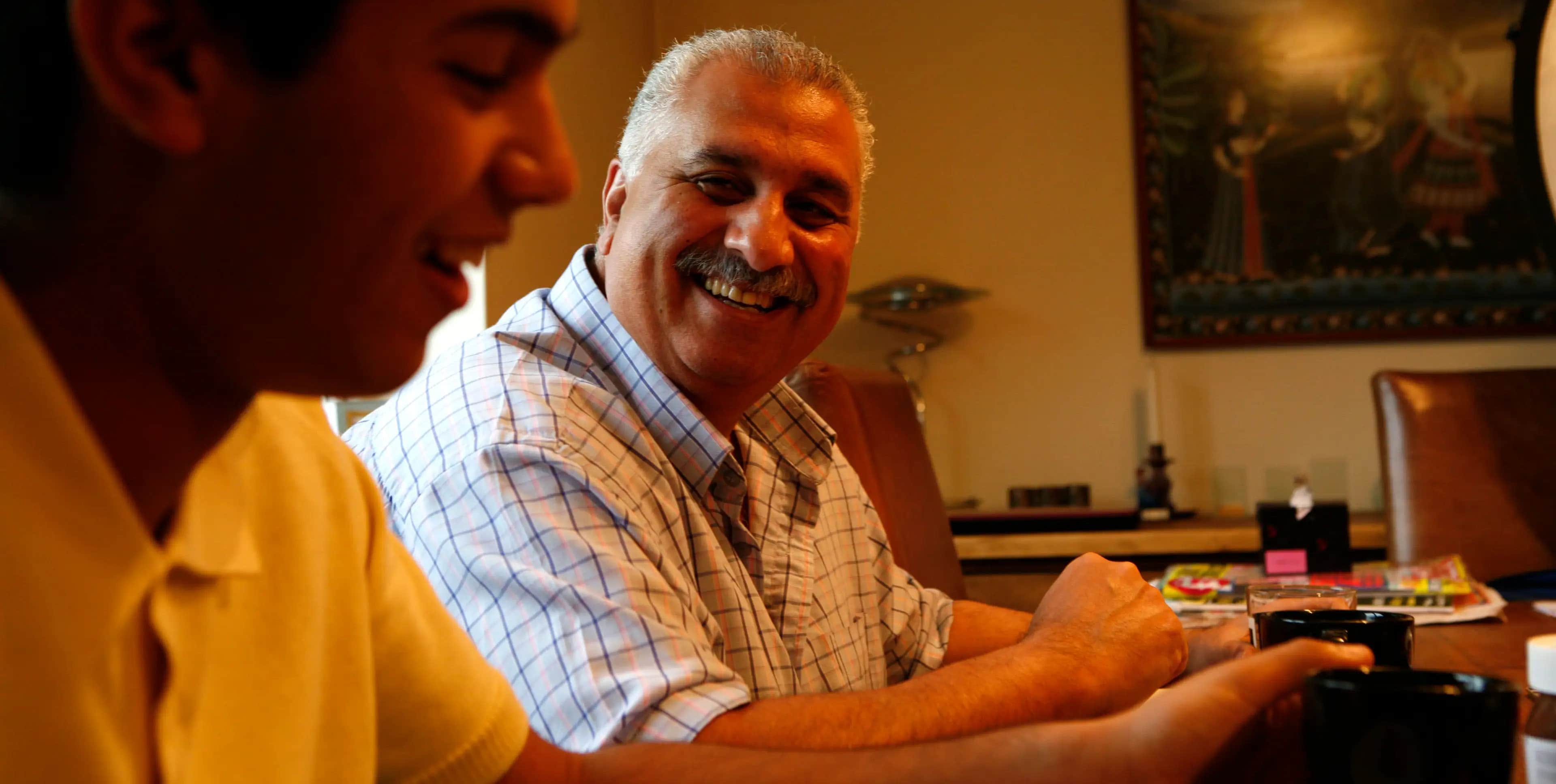 A picture of Nilesh, a kidney cancer patient, smiling.