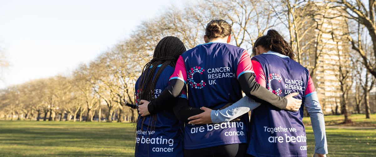 Group of supporters hugging.