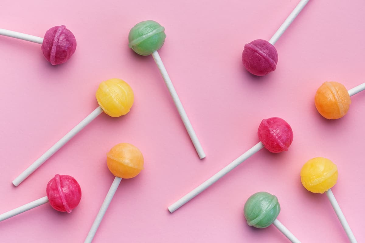 A bright and colourful image of lollipops on a table.