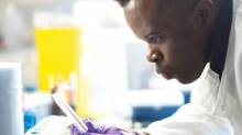 Scientist looking at petri dish